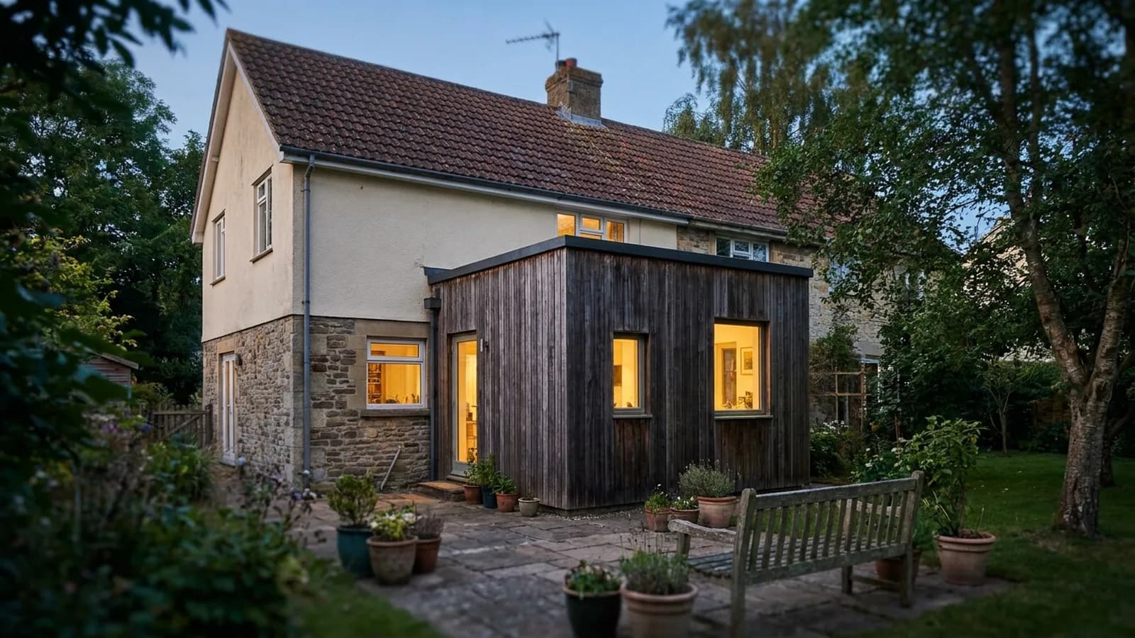 A rear addition on a house that visibly does not match the original roofline or siding